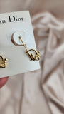 Christian Dior Logo Gold Tone pierced earrings - 1994